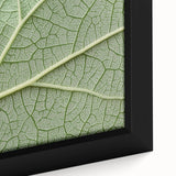 Close-up of textured, colorful floral art on extra large framed canvas, primarily in black, ideal for living room decor.