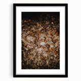 Abstract art print featuring swirling autumn hues on a black framed canvas, suitable for bedroom or dining room decor.