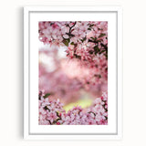 Abstract art print featuring swirling pastel colors in a white frame, suitable for bedroom or dining room decor.