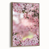 Side view of a framed canvas depicting a vintage landscape painting with spring themes in muted green and gold tones.