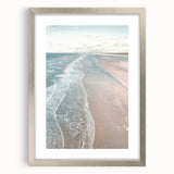 Textured abstract art print in silver frame with splashes of orange and blue, ideal for bedroom art.