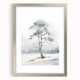 Textured art print of abstract winter scene in muted blue and white, framed in silver, suitable for bedroom decor.