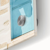 Large abstract wall art in vibrant orange and yellow tones on acrylic glass.