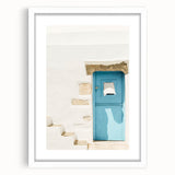 Abstract art print featuring swirls of blue and white, framed in white, ideal for modern bedroom or dining room decor.