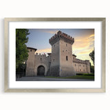 Elegant silver-framed landscape artwork showcasing a picturesque castle scene, complete with a white matting, perfect for enhancing home decor with a touch of sophistication.