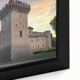 Close-up of a framed canvas depicting a picturesque landscape with a castle, showcasing vibrant colors and intricate details, perfect for home decor.