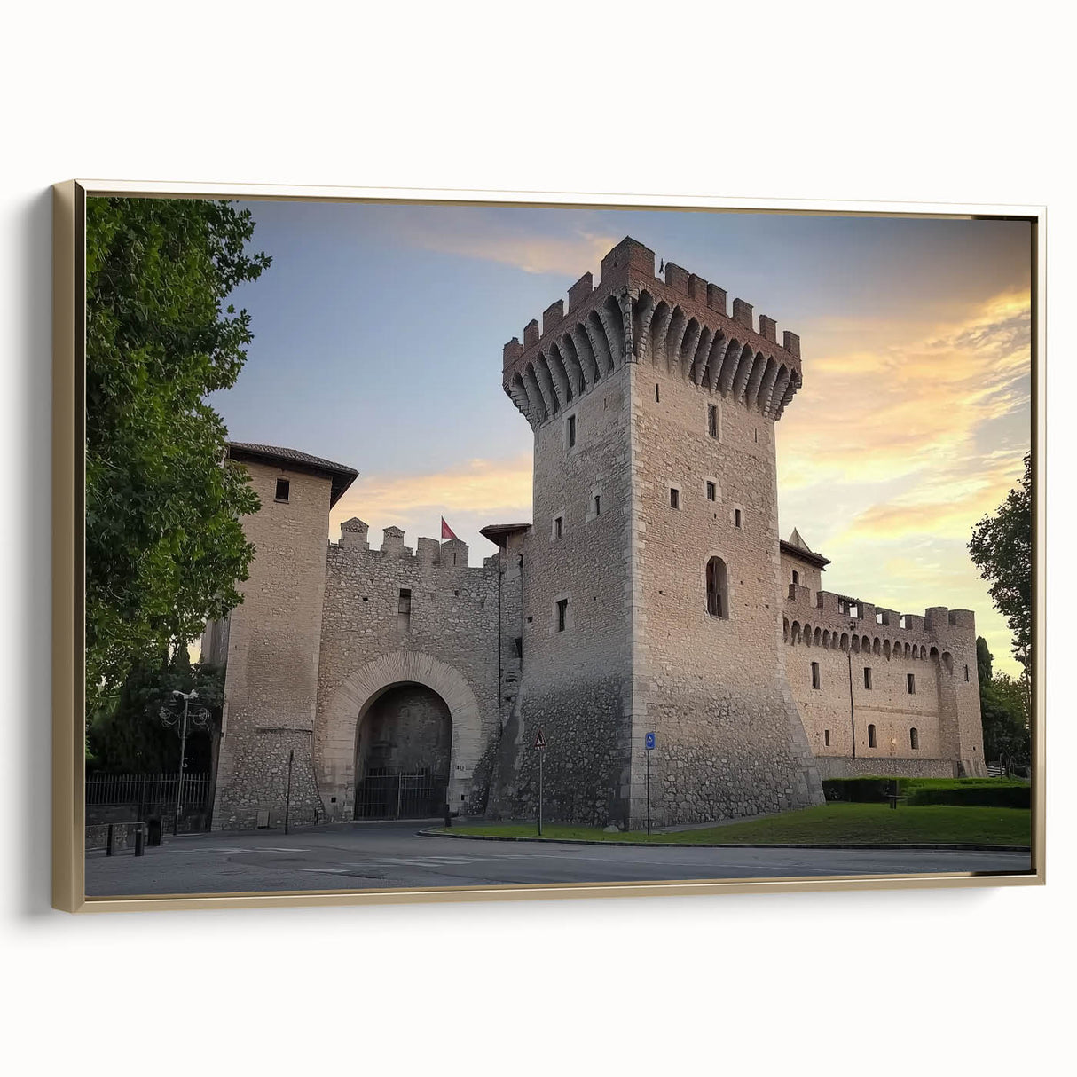 Framed canvas artwork showcasing a picturesque landscape with a majestic castle, highlighted by a gold frame, adding elegance to any decor setting.