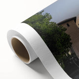 Rolled canvas artwork showcasing a stunning landscape with a majestic castle set against a vibrant blue sky, elegantly packaged in a protective cardboard tube. Ideal for home decor enthusiasts seeking unique wall art.