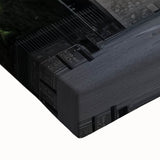 Close-up of a stretched canvas artwork depicting a serene landscape with a majestic castle, featuring vibrant colors and intricate details, ideal for home decor.