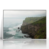 Framed acrylic landscape artwork depicting dramatic cliffs against a vibrant sunset, elegantly presented in a sleek white frame, ideal for modern home decor.