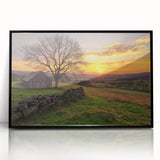 Black-framed acrylic landscape art piece showcasing a serene barn scene with lush greenery and a clear blue sky, perfect for rustic home decor.