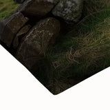 Close-up of a stretched canvas print showcasing a vibrant landscape design featuring rolling hills and a serene barn, perfect for rustic home decor.