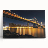 Stretched canvas artwork depicting a serene landscape bridge over a tranquil river, showcasing vibrant greens and blues, perfect for home decor or office settings.