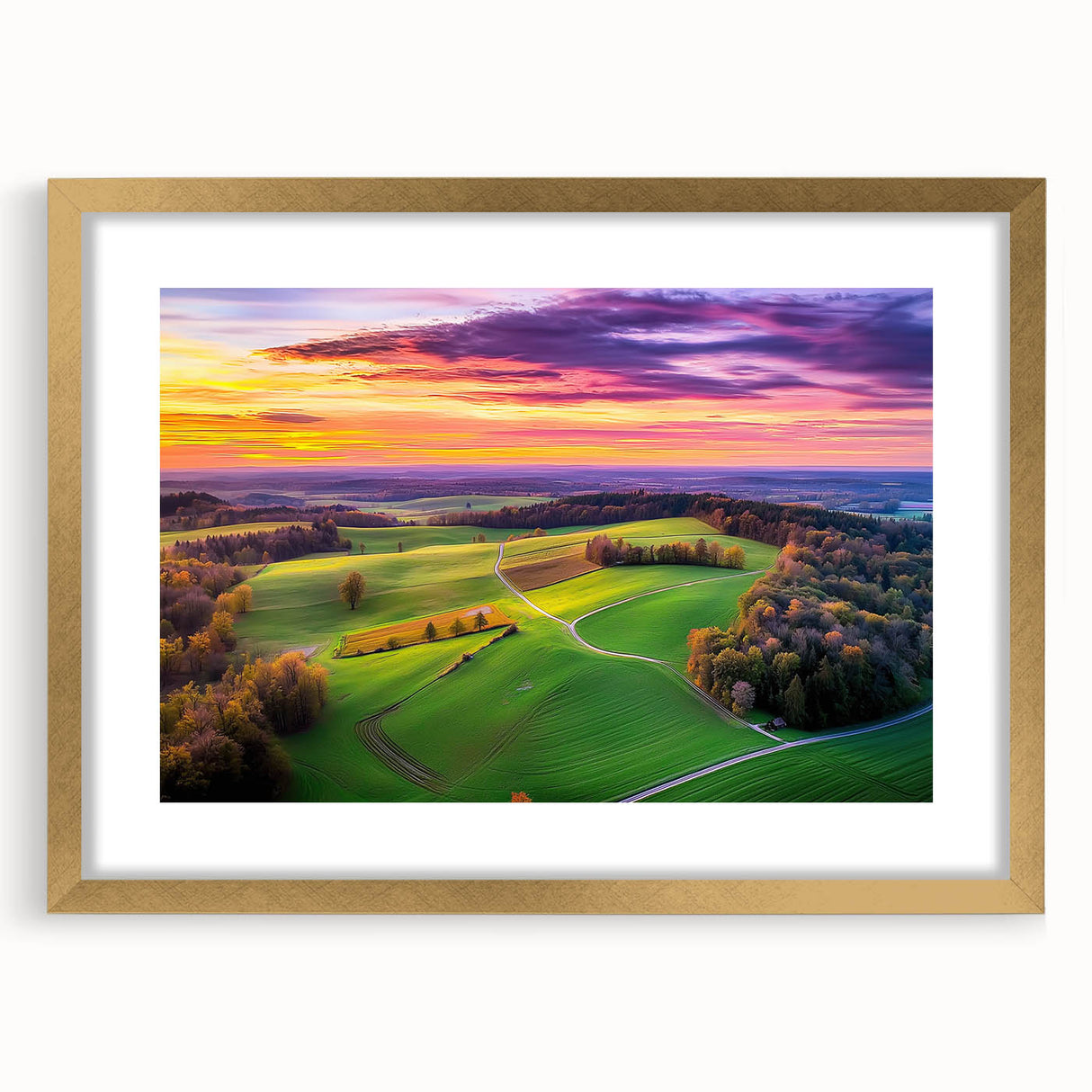 Elegant gold-framed countryside landscape artwork with a white mat, showcasing serene rolling hills and a vibrant sky, ideal for home decor and wall art enthusiasts.
