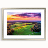 Framed landscape artwork showcasing a serene countryside scene with vibrant colors, set in a stylish silver frame with a mat, ideal for home decor.