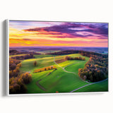 Framed canvas artwork showcasing a serene countryside landscape with rolling hills, lush greenery, and a clear blue sky, presented in a sleek white frame.