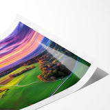 Scenic countryside landscape print showcasing rolling hills, vibrant green fields, and a clear blue sky, rolled up in protective cardboard packaging for shipping.