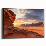 Framed canvas artwork depicting a stunning desert landscape with warm hues of orange and yellow, showcased from a black side view, perfect for home decor.