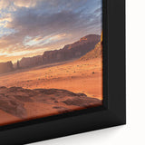 Close-up of a framed desert landscape canvas print, showcasing vibrant colors and intricate details of arid terrain, perfect for home decor and artistic ambiance.