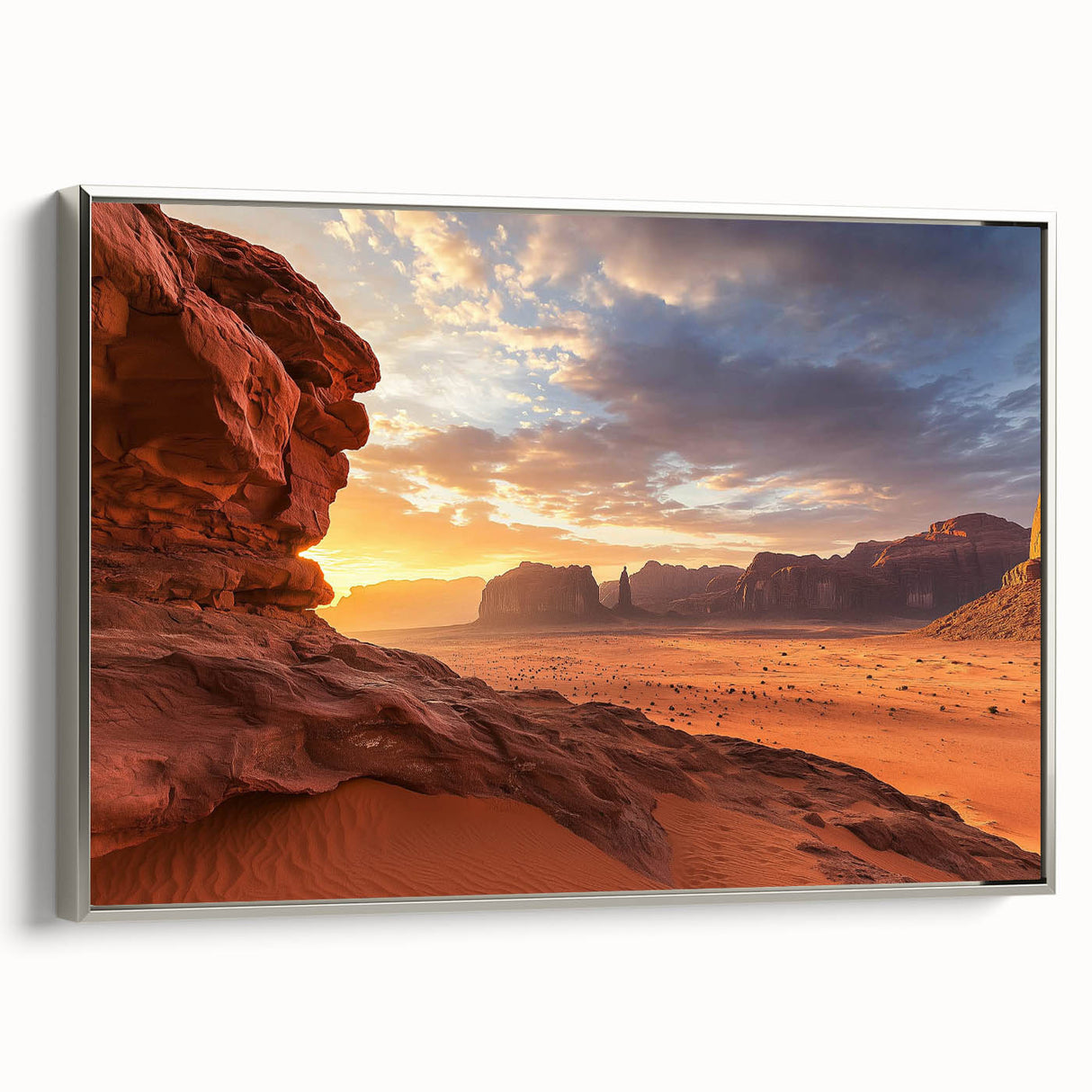 Framed canvas artwork depicting a vibrant desert landscape with warm tones of orange and gold, accented by a sleek silver frame for modern decor appeal.