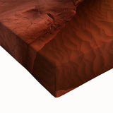 Close-up of a vibrant stretched canvas depicting a serene desert landscape, showcasing warm earth tones and intricate details, perfect for enhancing modern home decor.