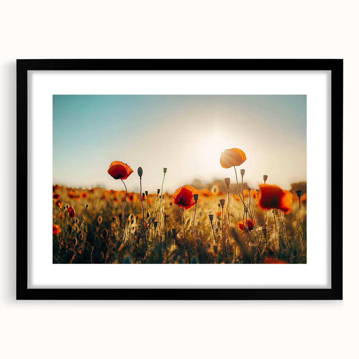 Framed landscape artwork featuring lush green fields under a bright blue sky, presented in a sleek black frame with a white mat, ideal for home decor.