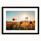 Framed landscape artwork featuring lush green fields under a bright blue sky, presented in a sleek black frame with a white mat, ideal for home decor.