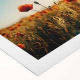 Vibrant rolled canvas print showcasing a serene landscape of rolling green fields under a blue sky, perfect for home decor or office styling, packaged securely in a cardboard tube.