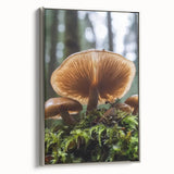 Framed canvas featuring a vintage landscape art painting with colorful florals against a black background.