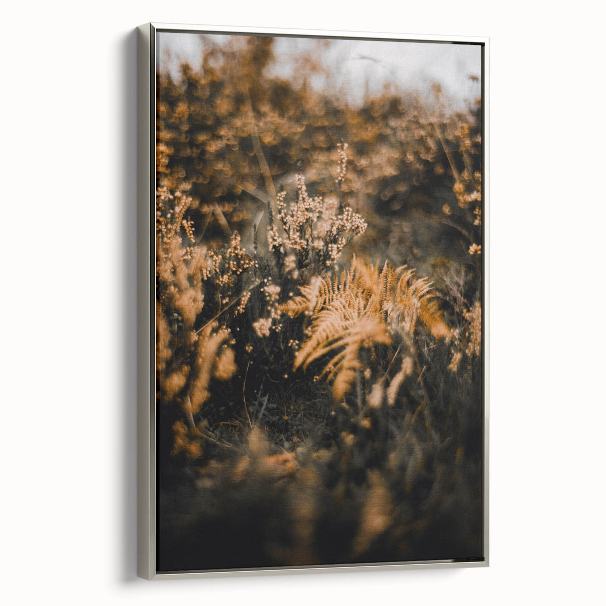 Framed canvas depicting a vintage-style landscape with colorful autumn trees against a black background.