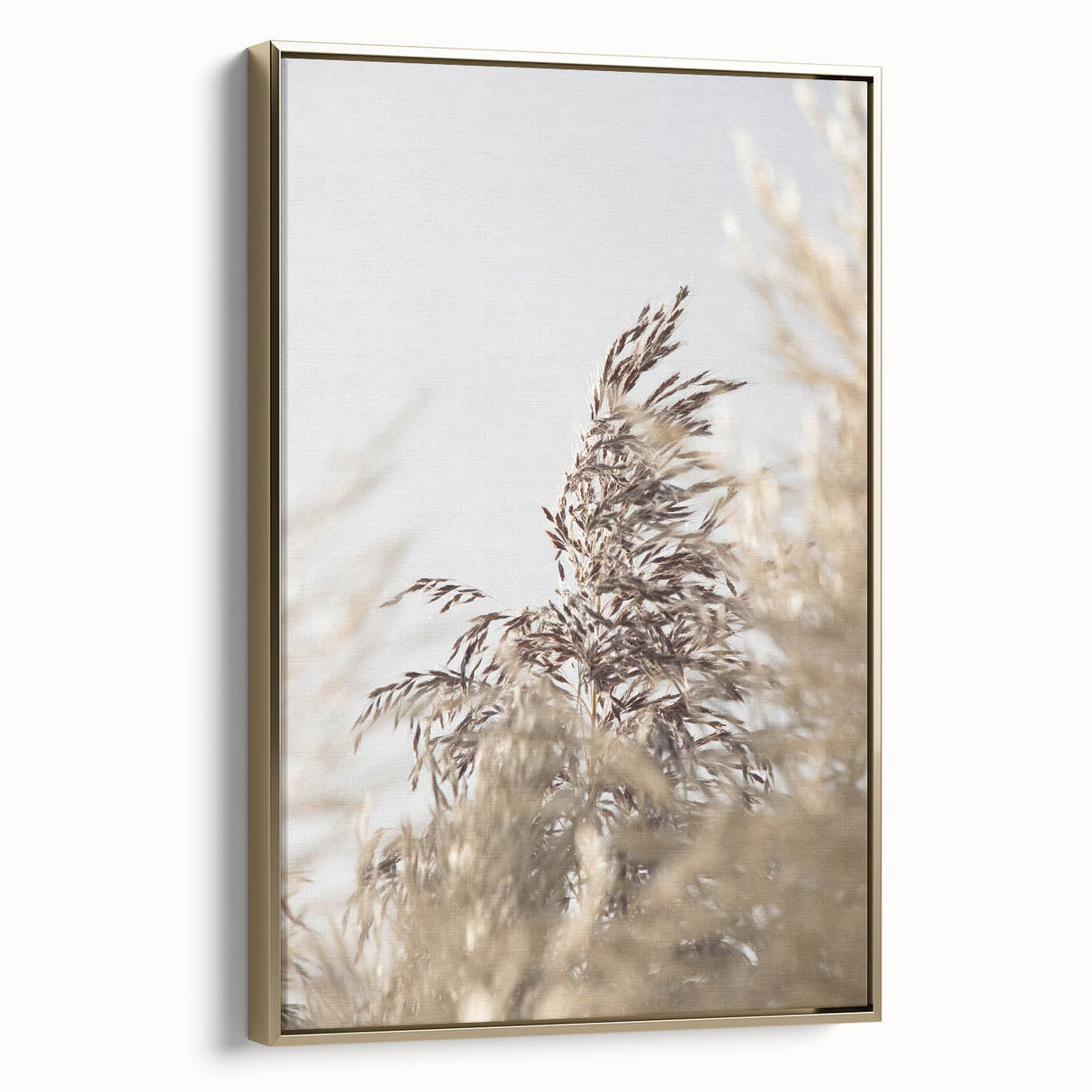 Framed canvas featuring a vintage landscape painting of summer season in muted gold and black tones.