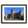 Black-framed landscape artwork featuring a majestic castle surrounded by lush greenery, designed for elegant home decor. Ideal for enhancing interior aesthetics.