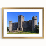 Elegant gold-framed landscape artwork depicting a majestic castle surrounded by lush greenery, showcasing intricate details and a sophisticated mat finish, ideal for home decor.