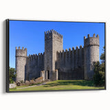 Framed canvas artwork showcasing a picturesque landscape featuring a majestic castle, with a sleek black frame enhancing its elegance. The vivid colors and intricate details create a stunning visual centerpiece for home decor.
