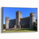 Framed canvas artwork of a scenic landscape featuring a majestic castle, adorned with a silver frame, showcasing vibrant colors and intricate details, perfect for home decor.