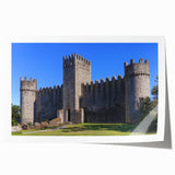 Rolled art print showcasing a vibrant landscape featuring a majestic castle surrounded by lush greenery and a clear blue sky, ideal for home decor enthusiasts.