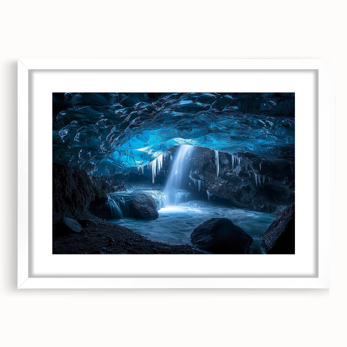 Framed landscape artwork showcasing a stunning cave scene, featuring rich earth tones and intricate details, presented in a white mat for a polished look.