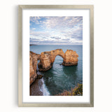Framed landscape artwork of majestic cliffs in a silver frame with a mat, showcasing natural beauty and elegance, perfect for home décor enhancement.