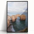 Framed acrylic landscape artwork showcasing dramatic cliffs against a vibrant sunset, presented in a sleek black frame, ideal for modern home decor.