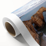 Stunning rolled canvas artwork depicting a dramatic landscape of majestic cliffs under a vibrant sunset, perfect for enhancing home decor with natural beauty.