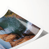 Stunning landscape print of rugged cliffs and vibrant blue skies, rolled and neatly packaged in a protective cardboard tube, perfect for home decor.