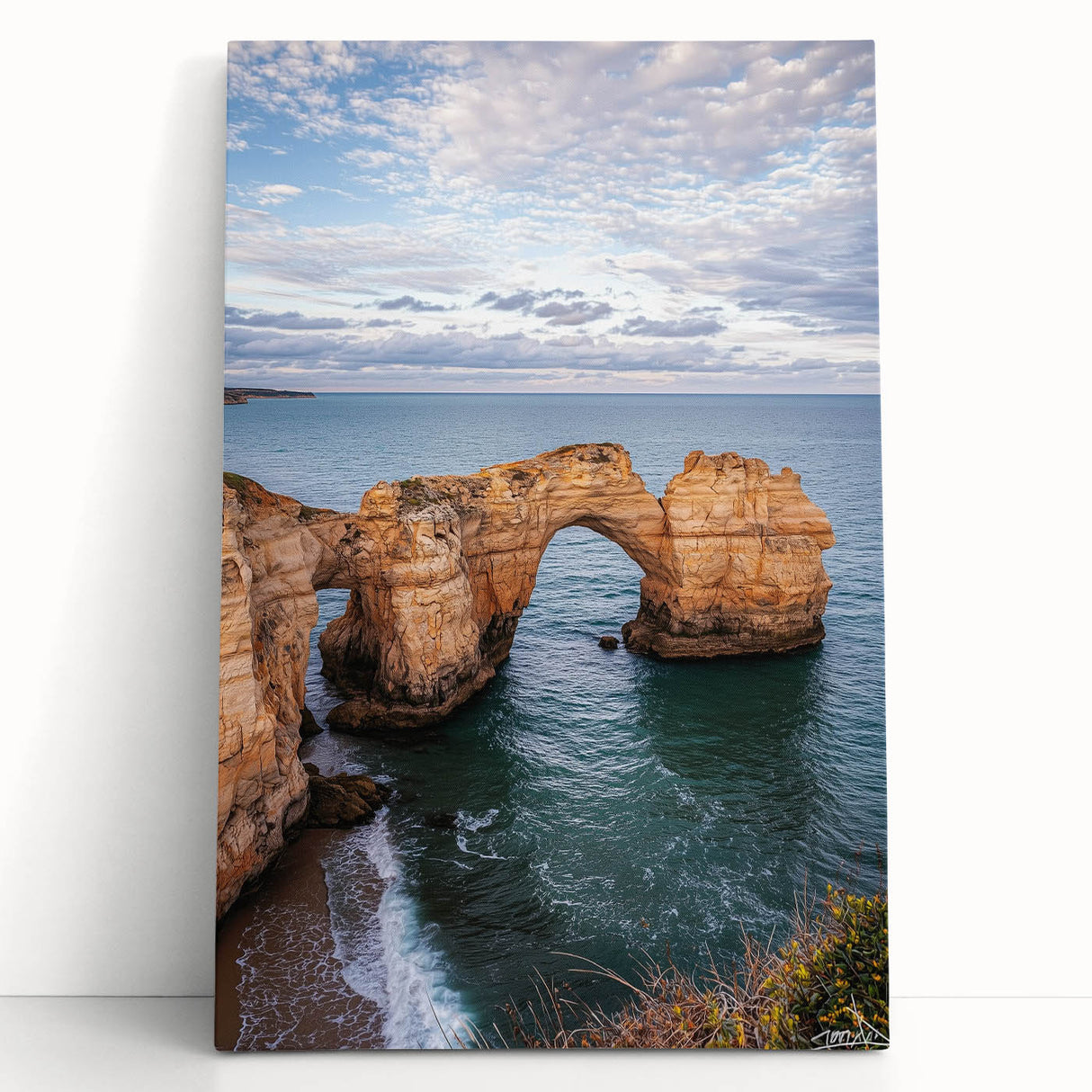 Stretched canvas artwork depicting a stunning coastal landscape with dramatic cliffs and vibrant blue ocean waves, perfect for enhancing modern home decor.