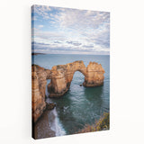 Stretched canvas artwork depicting dramatic cliffs under a vibrant sunset, showcasing rich colors and detailed textures, ideal for enhancing home decor.