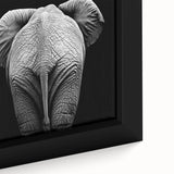 Close-up of a framed canvas showcasing a vibrant, colorful design featuring various stylized animals, ideal for enhancing home decor and art collections.