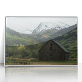 Framed acrylic artwork featuring a charming landscape scene of a rustic barn, set against a serene backdrop, ideal for home decor and enhancing interior spaces.