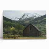 Stretched canvas artwork depicting a serene landscape with a rustic barn, showcasing vibrant colors and rich textures, perfect for home decor enhancements.
