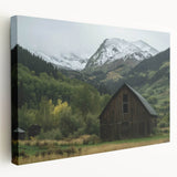 Stretched canvas artwork depicting a serene landscape featuring a rustic barn surrounded by lush greenery, ideal for home decor enthusiasts.