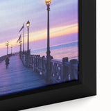 Framed canvas artwork depicting a serene landscape bridge over a tranquil river, featuring lush greenery and vibrant colors that enhance any decor.