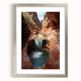 Landscape artwork of canyons in a silver frame with a mat, showcasing vibrant colors and intricate details, perfect for enhancing home decor and interior design.