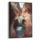 Framed canvas artwork showcasing a stunning landscape of canyons in rich earth tones, set against a sleek black frame, ideal for enhancing modern home decor.